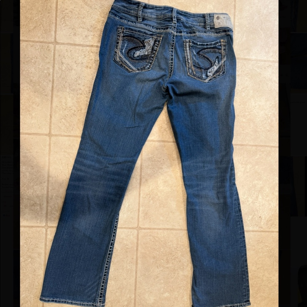 Silver jeans, medium wash boots cut